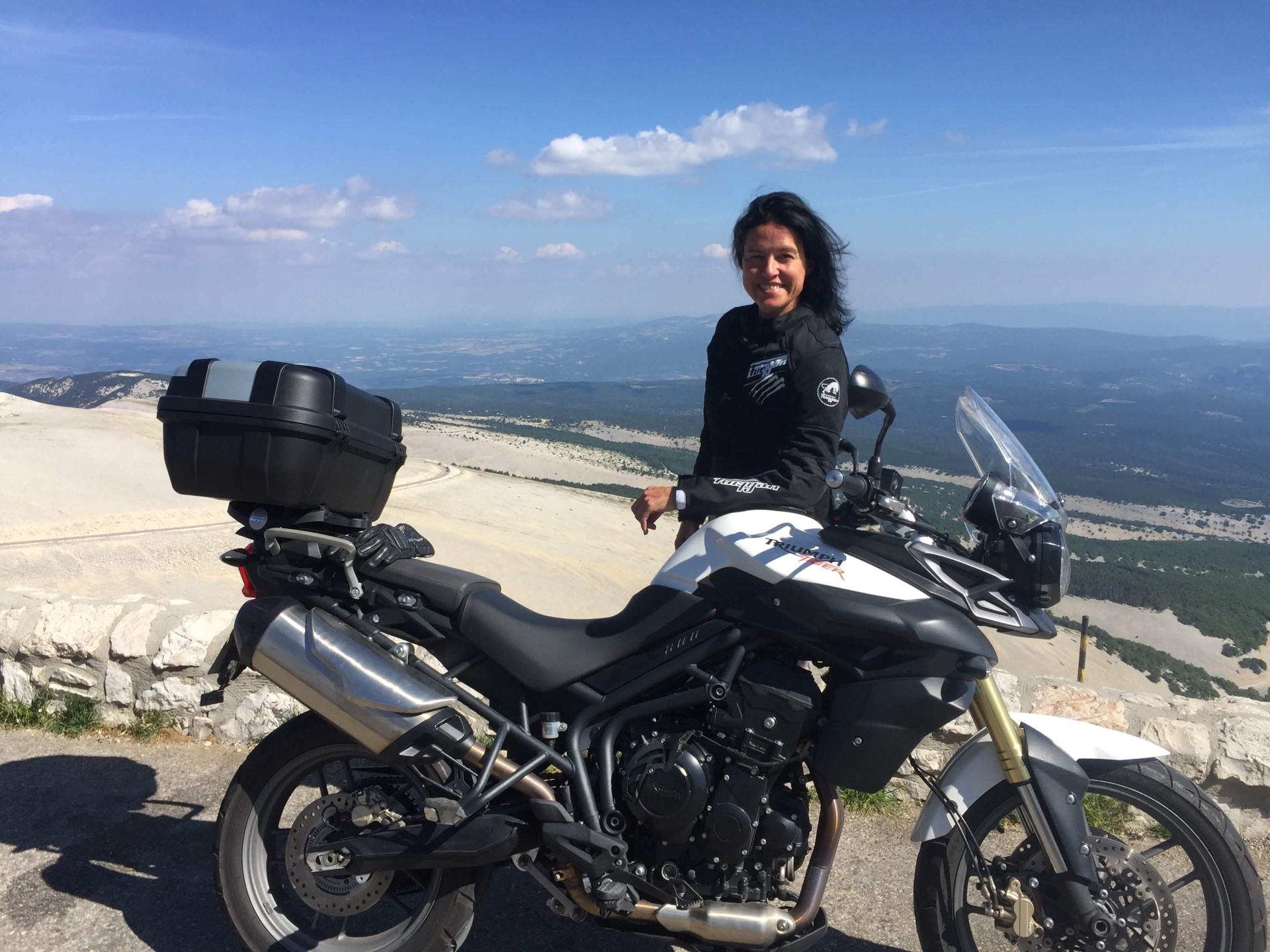 Sam Raymond with her Triumph motorcyce